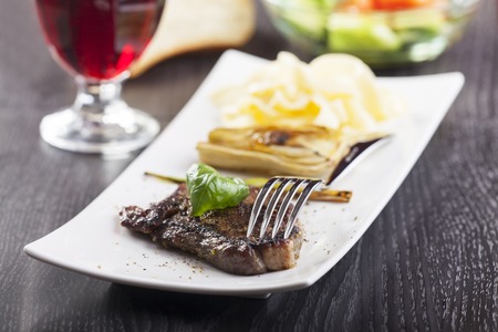 steak with basil and pastaの写真素材