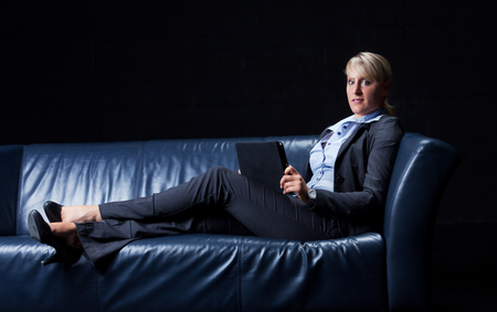 business woman on a couchの写真素材