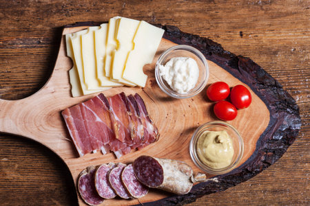 south tyrolean specialites on woodの写真素材