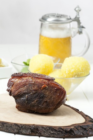 bavarian roasted pork on woodの写真素材