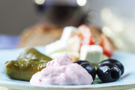 greek taramas and stuffed wine leaves with salad の写真素材