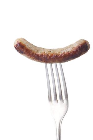 nuremberger sausage on a silver fork の写真素材