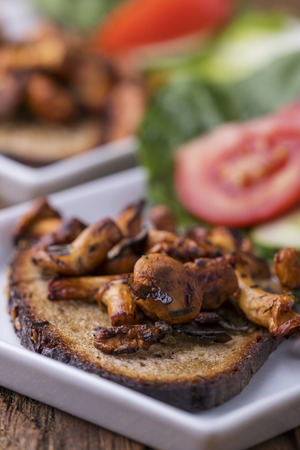 grilled chanterelles on a slice of breadの写真素材