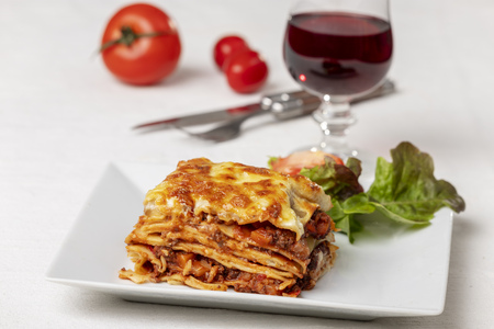 portion of lasagna on a plateの写真素材