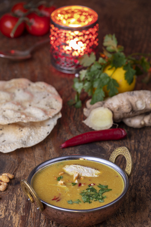 indian Mulligatawny soup in a brass bowlの写真素材