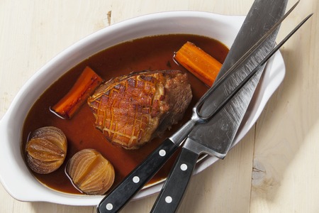 bavarian pork meat in a baking dishの写真素材