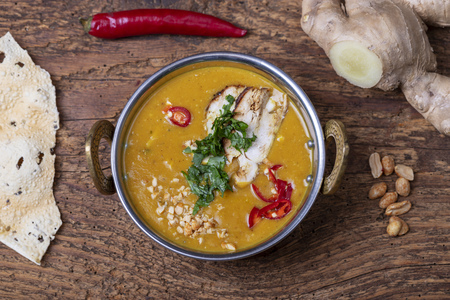 indian Mulligatawny soup in a brass bowlの写真素材