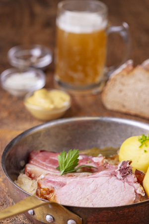 closeup of a french choucroute dish on woodの写真素材
