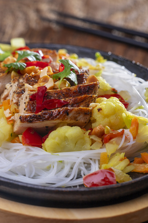 steaming hot sizzler on woodの写真素材