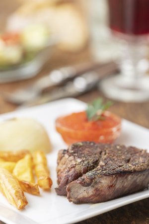 grilled steak on a plateの写真素材
