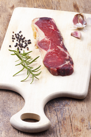 raw dry aged steak on woodの写真素材