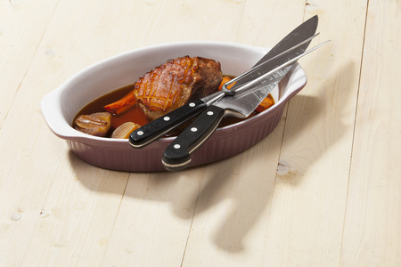 bavarian pork meat in a baking dishの写真素材