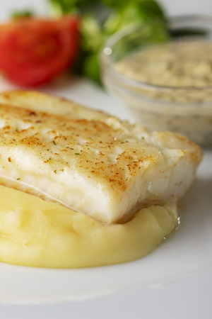 grilled cod on a plateの写真素材