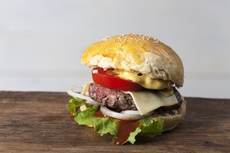 home made hamburger on rustic woodの写真素材