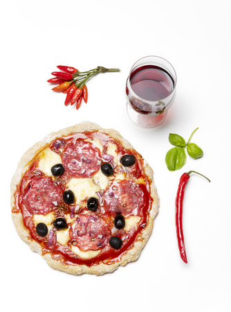 overview of a pizza with wineの写真素材
