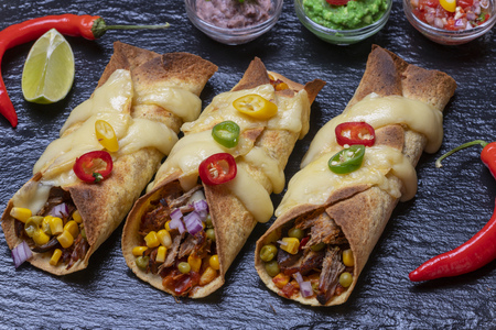 overview of baked enchiladas with salsaの写真素材
