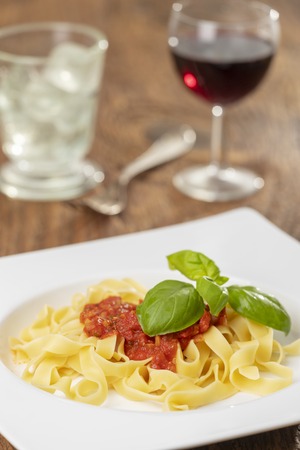 italian tagliatella pasta with tomato sauceの写真素材