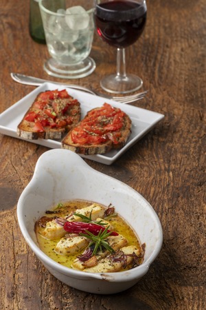grilled feta with herbs in oilの写真素材