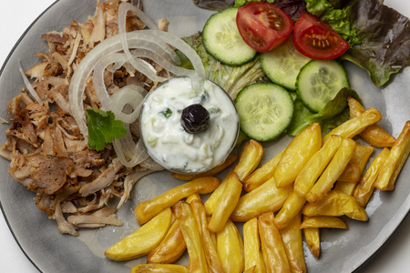 greek gyros with tzaziki and friesの写真素材