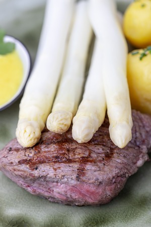 closeup of asparagus on a steakの写真素材