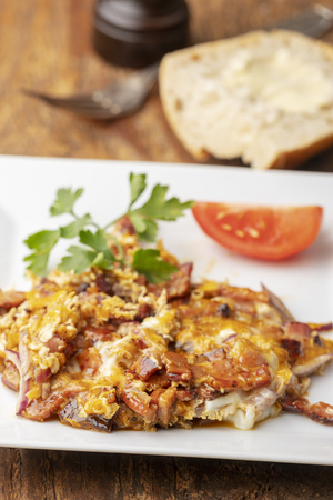 closeup of scrambled eggs with baconの写真素材
