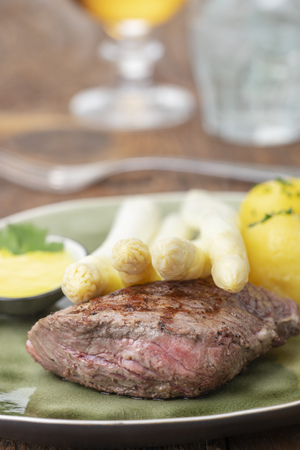 closeup of asparagus on a steakの写真素材