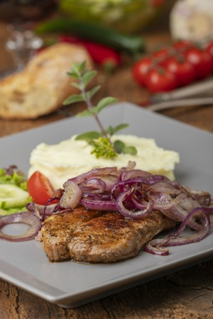 grilled pork steak with onions の写真素材