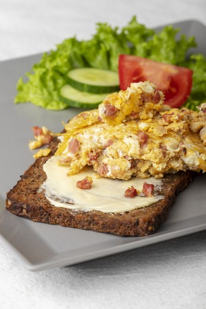 scrambled eggs on a rye bread の写真素材