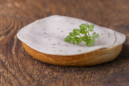 bun on wood with sausage の写真素材
