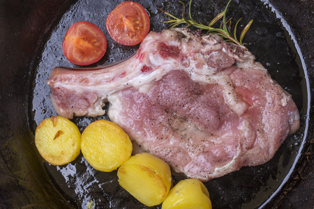 veal cutlet in an iron panの写真素材