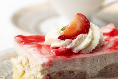 strawberry cake and a cup of coffeeの写真素材