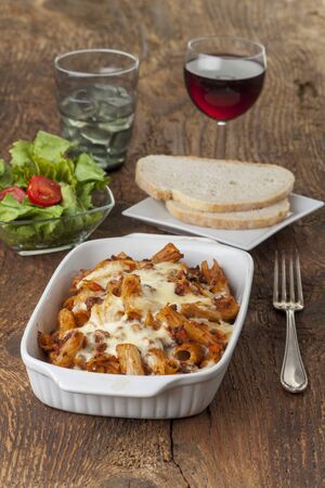 rigatoni pasta with sauce bolognaise and cheeseの写真素材