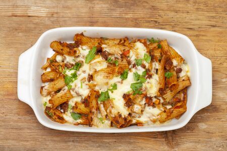 rigatoni pasta with sauce bolognaise and cheeseの写真素材