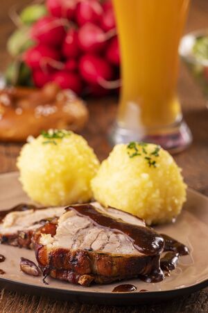 bavarian roasted pork with potato dumplingsの写真素材