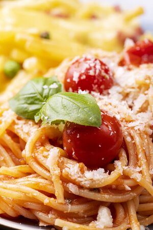 closeup of spaghetti with tomatoes and basilの写真素材