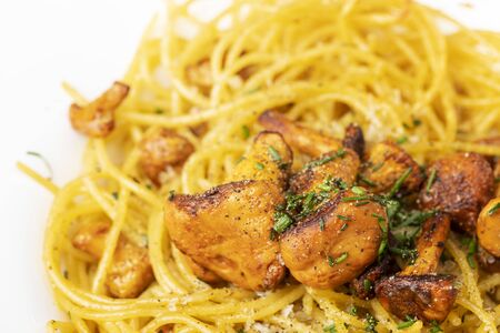 italian spaghetti with chanterelles on woodの写真素材