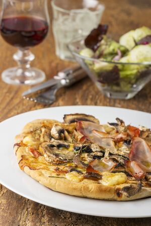 rustic home made mushroom pizzaの写真素材