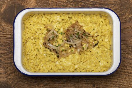 closeup of bavarian kaes spaetzle on woodの写真素材