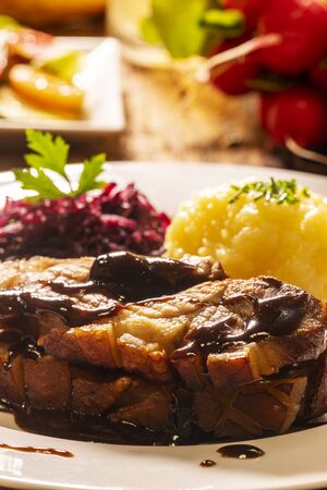 bavarian roasted pork with dumplings and cabbageの写真素材