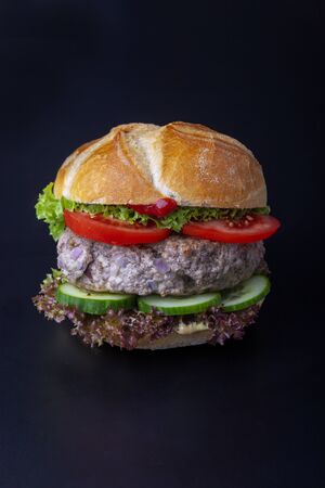 bavarian burger in a typical bunの写真素材