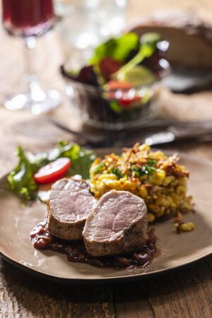 swabian pork fillet with spaetzle on woodの写真素材