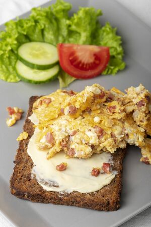 scrambled eggs on a rye breadの写真素材