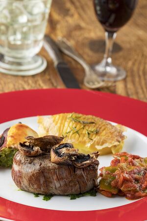 grilled steak on a plate with wineの写真素材