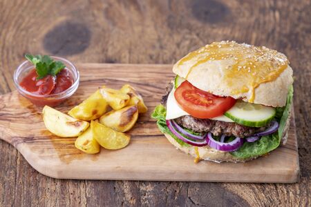 home made burger on dark woodの写真素材