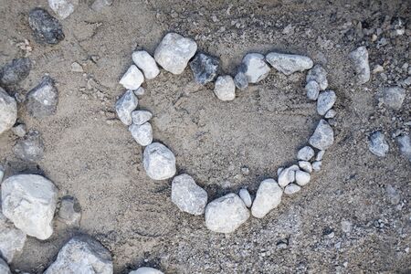 Stone heart on the floorの写真素材