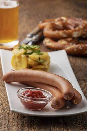 closeup of frankfurter sausages on rustic woodの写真素材