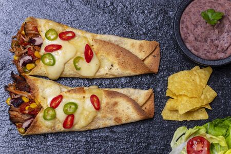 overview of enchiladas on slateの写真素材