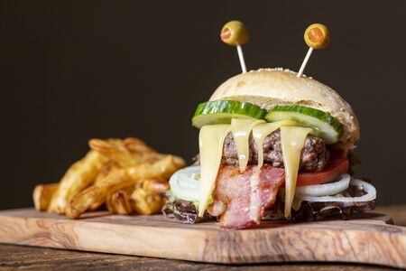 monster burger for halloween on woodの写真素材