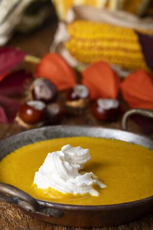 pumpkin soup on dark woodの写真素材