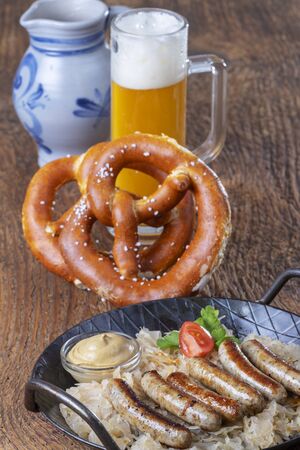 grilled nuremberger bratwurst with sauerkrautの写真素材